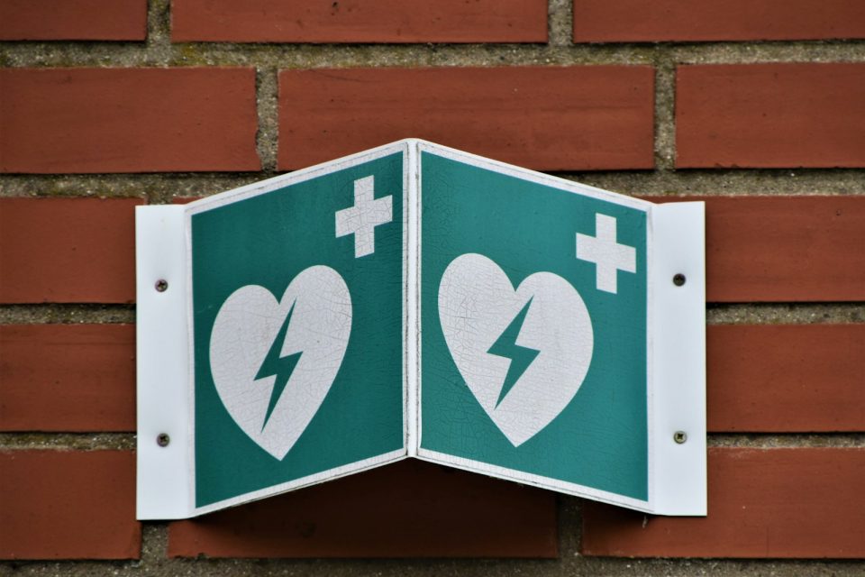 green and white arrow sign